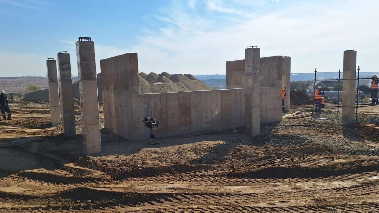 Cast in-situ concrete walls and columns standing on a stripped site